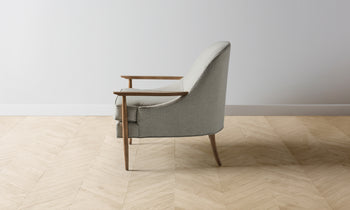 leroy mid-century modern accent chair in grey merino with wooden arms and legs - side view