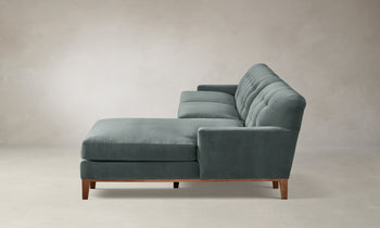 ludlow tufted chaise sectional sofa with wooden base in seafoam velvet