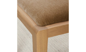 madison dining chair in brown ash wood  with beige mohair fabric, close up view