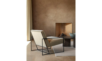 mercer white geometric accent chair with steel frame in a modern living room