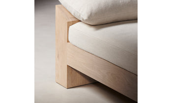 montauk wooden daybed in white linen with throw pillows - close up