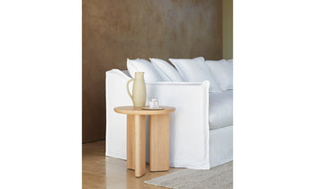 morro side table in light ash wood in a modern living room