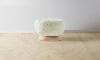 mott stool with wood base and white shearling fabric - front view