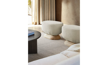 mott stool with wood base and white leather in a modern living room