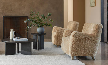 perry accent chair in beige boucle and wooden legs in a modern design living room