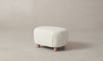 perry ottoman in white boucle fabric with maple wood legs