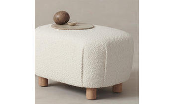 perry white boucle ottoman with maple wood legs, decorated