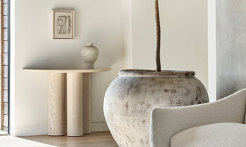 reade demilune console table in white ash wood in a modern living room