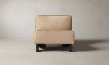 remsen accent chair upholstered in brown pony hair with wooden legs and geometric design - front view