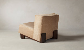 remsen accent chair upholstered in brown pony hair with wooden legs and geometric design - back view