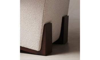 remsen accent chair upholstered in brown pony hair with wooden legs and geometric design - close up