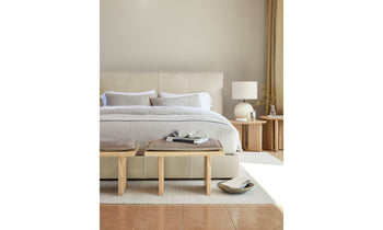 reyes wooden stool with gray leather cushion in modern bedroom setting