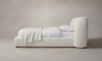 smith bed with upholstered frame and headboard in white boucle - side view