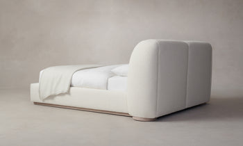 smith bed with upholstered frame and headboard in white boucle - back view