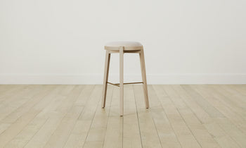 stanton wood barstool in white ash wood with white leather seat and brass footrest, side view