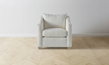 sullivan accent chair in white boucle with wooden legs - front view