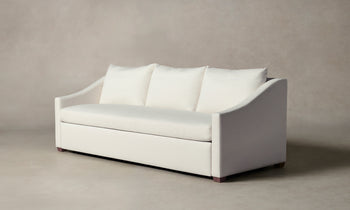 sullivan sleeper sofa in white linen with wooden legs - angle view