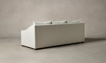 sullivan sleeper sofa in white linen with wooden legs - back view