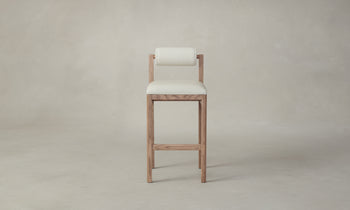 thayer wood barstool in oak with white leather seat and boucle bolster back, front view