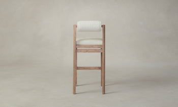 thayer wood barstool in oak with white leather seat and boucle back, back view