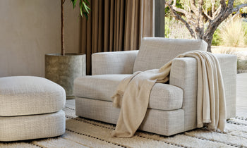 varick chair and a half with ottoman in grey linen in a modern living room