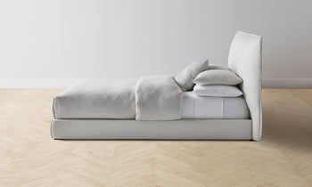 wythe upholstered bed in white linen - side view