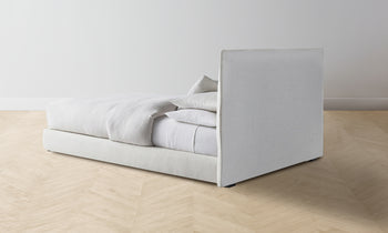 wythe upholstered bed in white linen - back view