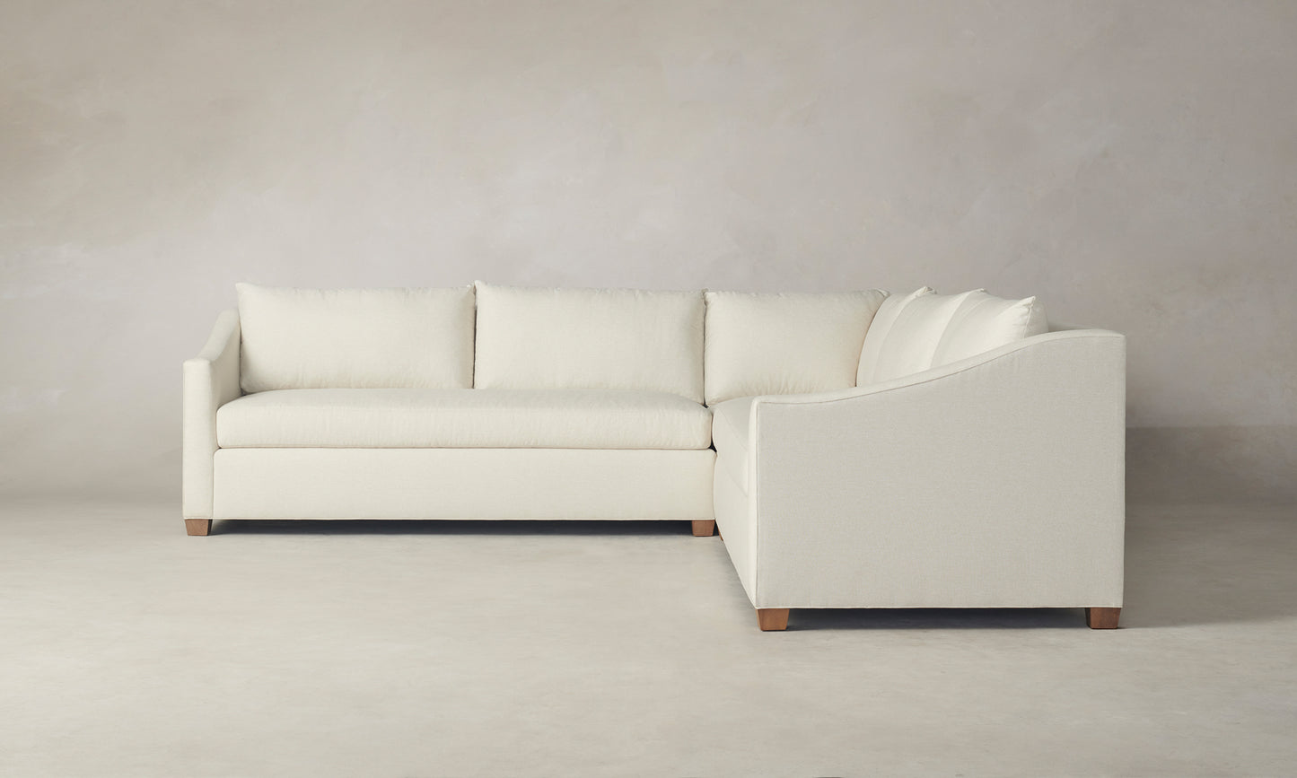 l-shaped corner sectional in white with wooden legs - sullivan sectional