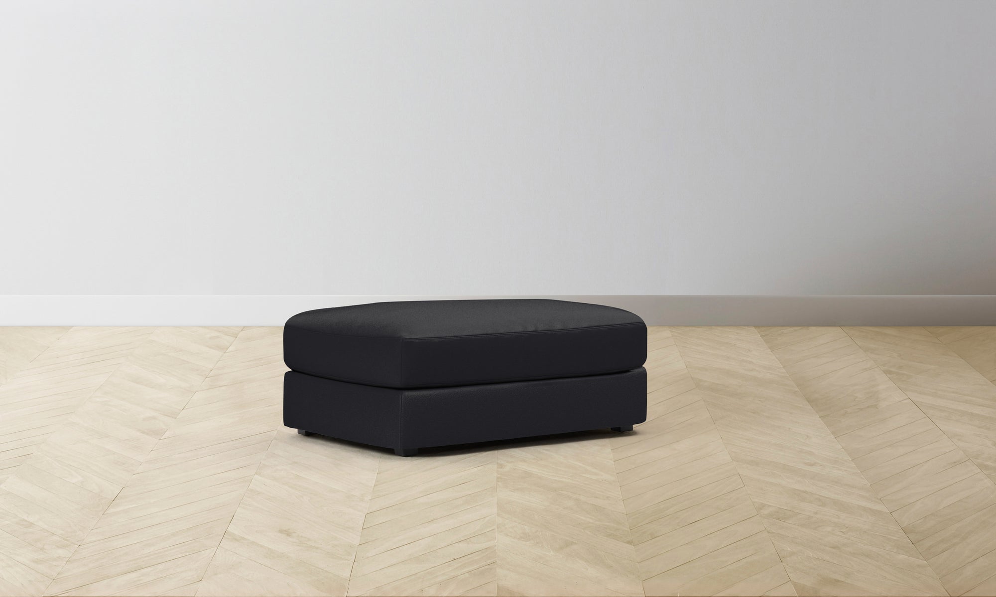 The Varick Ottoman - Pebbled Leather Ink