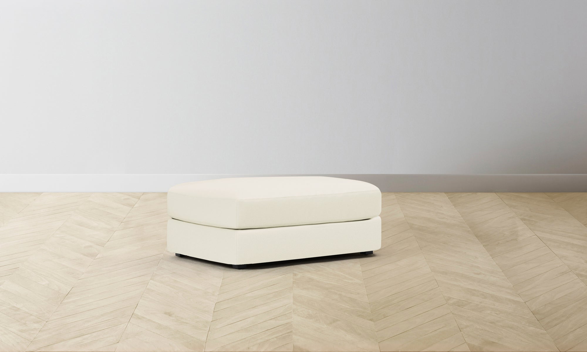 The Varick Ottoman - Pebbled Leather Swan